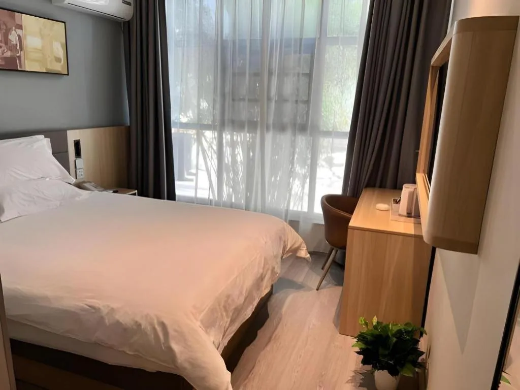 Bed in Jinjiang Inn Wuxi Liangqing Road Wanda Plaza Yunhe Bay Industrial Center