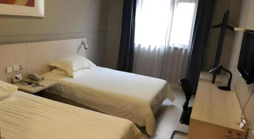 Bed in Jinjiang Inn Wuxi Liangqing Road Wanda Plaza Yunhe Bay Industrial Center