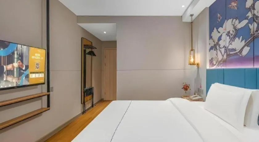 Bed in Jinjiang Inn Wuxi Liangqing Road Wanda Plaza Yunhe Bay Industrial Center