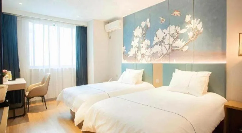 Bed in Jinjiang Inn Wuxi Liangqing Road Wanda Plaza Yunhe Bay Industrial Center