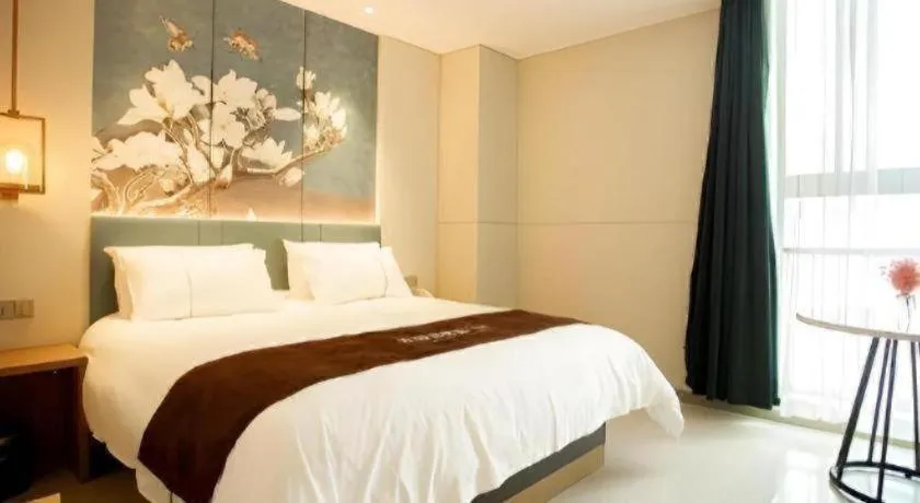Bed in Jinjiang Inn Wuxi Liangqing Road Wanda Plaza Yunhe Bay Industrial Center