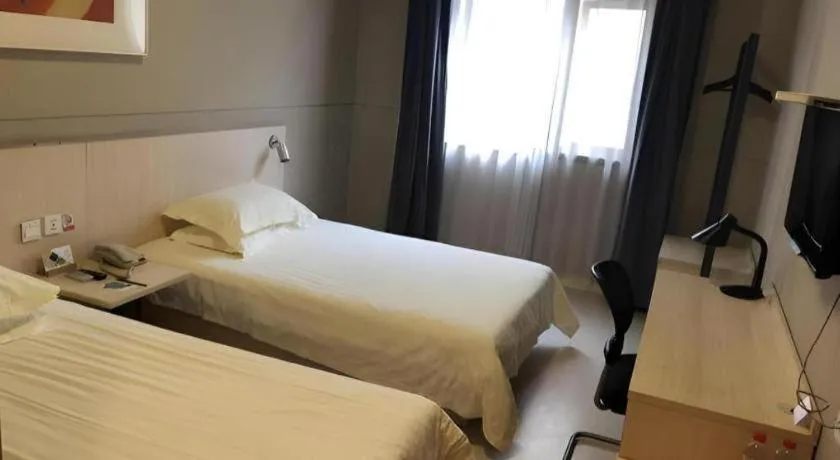 Bed in Jinjiang Inn Wuxi Liangqing Road Wanda Plaza Yunhe Bay Industrial Center