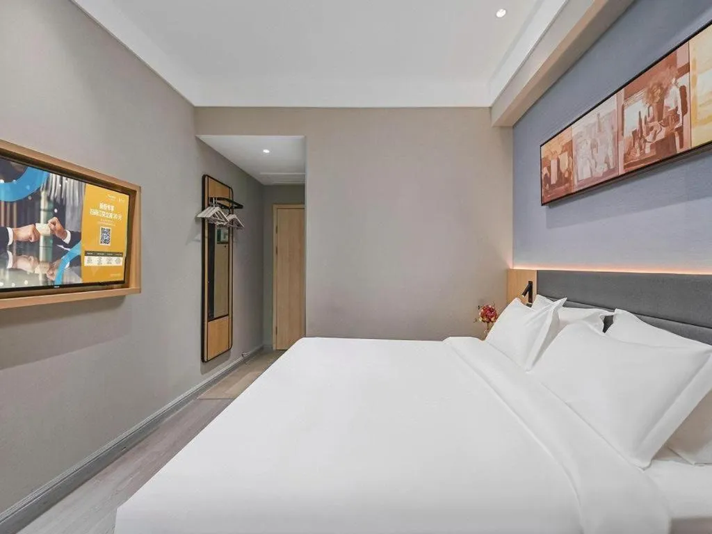 Bed in Jinjiang Inn Wuxi Liangqing Road Wanda Plaza Yunhe Bay Industrial Center