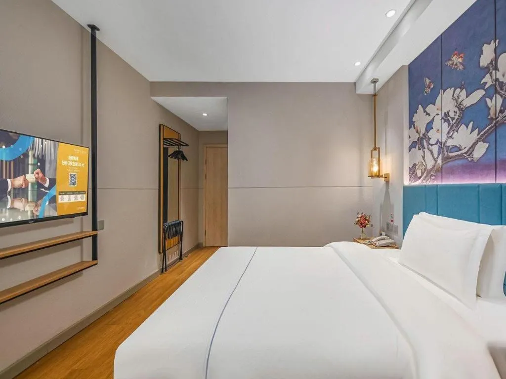 Bed in Jinjiang Inn Wuxi Liangqing Road Wanda Plaza Yunhe Bay Industrial Center