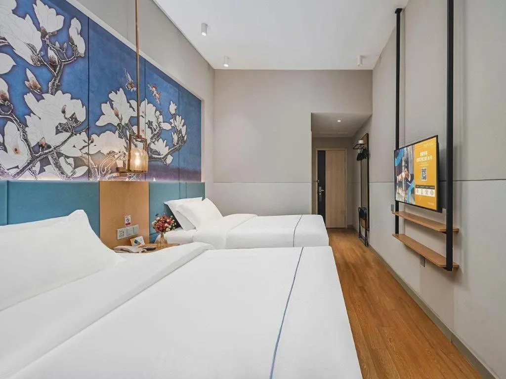 Bed in Jinjiang Inn Wuxi Liangqing Road Wanda Plaza Yunhe Bay Industrial Center