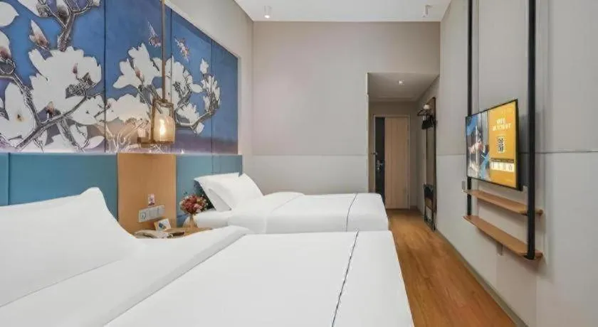 Bed in Jinjiang Inn Wuxi Liangqing Road Wanda Plaza Yunhe Bay Industrial Center