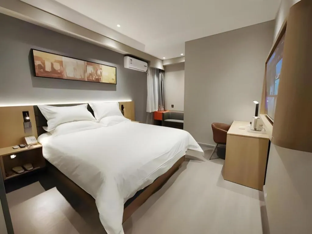 Bed in Jinjiang Inn Wuxi Liangqing Road Wanda Plaza Yunhe Bay Industrial Center