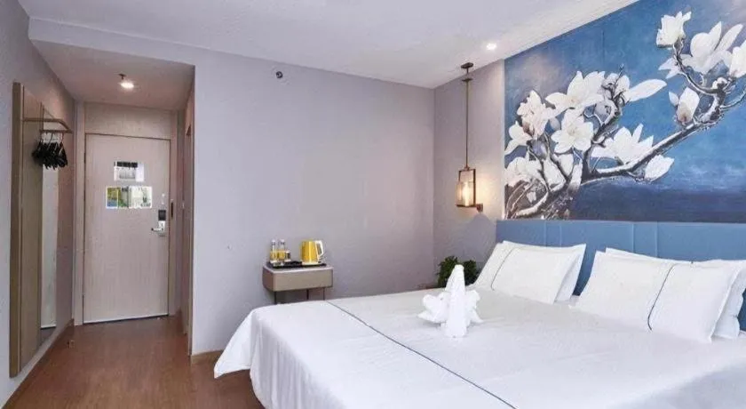 Bed in Jinjiang Inn Wuxi Liangqing Road Wanda Plaza Yunhe Bay Industrial Center