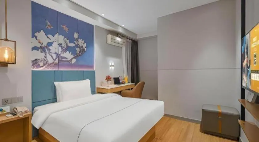 Bed in Jinjiang Inn Wuxi Liangqing Road Wanda Plaza Yunhe Bay Industrial Center