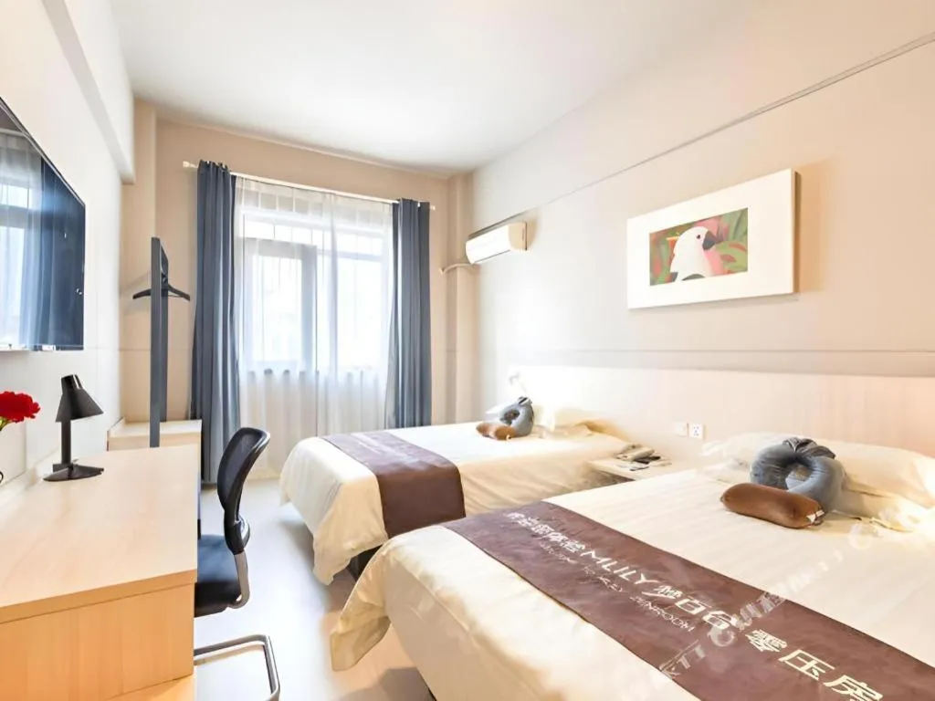 Bed in Jinjiang Inn Wuxi Liangqing Road Wanda Plaza Yunhe Bay Industrial Center