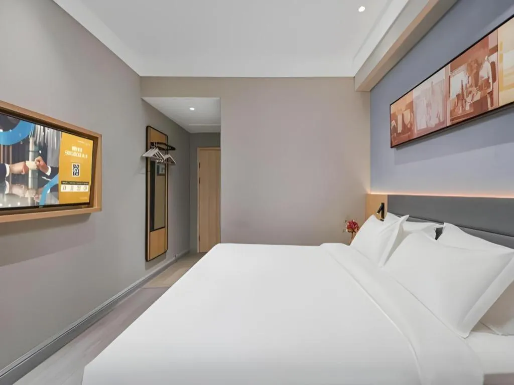 Bed in Jinjiang Inn Wuxi Liangqing Road Wanda Plaza Yunhe Bay Industrial Center