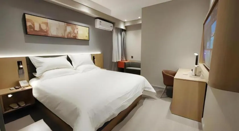 Bed in Jinjiang Inn Wuxi Liangqing Road Wanda Plaza Yunhe Bay Industrial Center