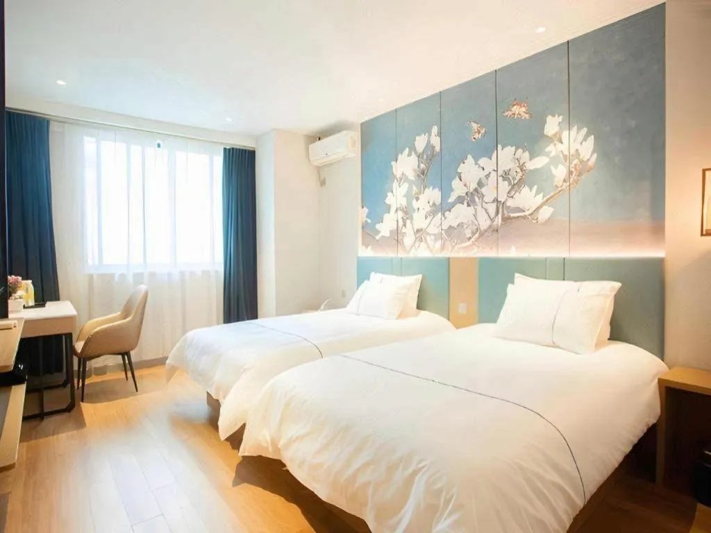 Bed in Jinjiang Inn Wuxi Liangqing Road Wanda Plaza Yunhe Bay Industrial Center
