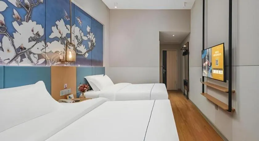 Bed in Jinjiang Inn Wuxi Liangqing Road Wanda Plaza Yunhe Bay Industrial Center