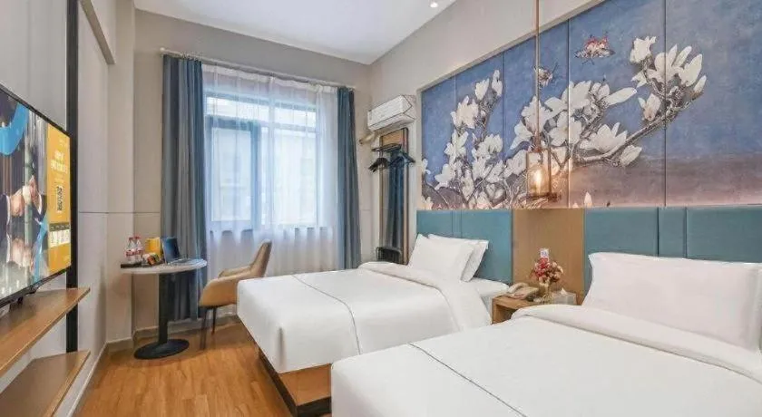 Bed in Jinjiang Inn Wuxi Liangqing Road Wanda Plaza Yunhe Bay Industrial Center