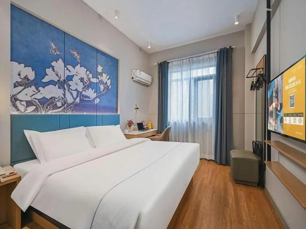Bed in Jinjiang Inn Wuxi Liangqing Road Wanda Plaza Yunhe Bay Industrial Center