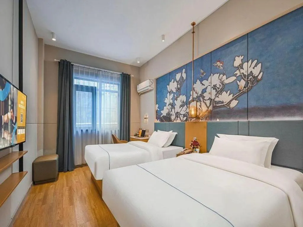Bed in Jinjiang Inn Wuxi Liangqing Road Wanda Plaza Yunhe Bay Industrial Center