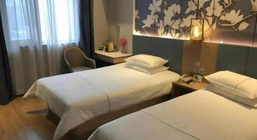Bed in Jinjiang Inn Wuxi Liangqing Road Wanda Plaza Yunhe Bay Industrial Center