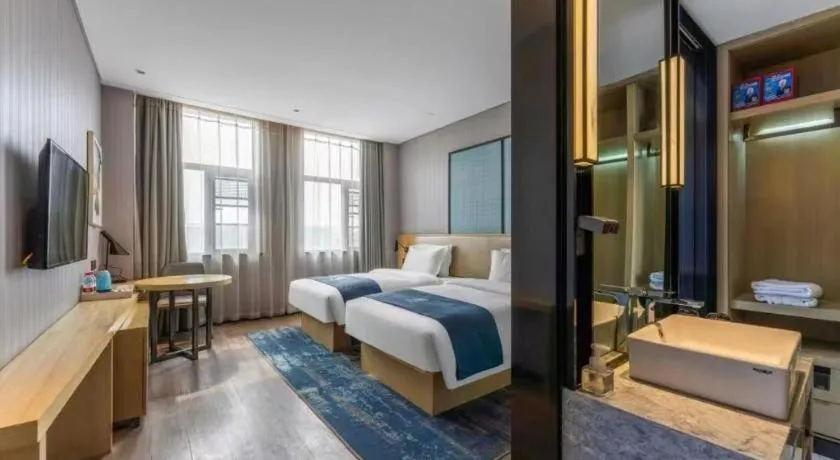 Bed in Echarm Hotel Wuhan Changjiang New District Gaoche Metro Station