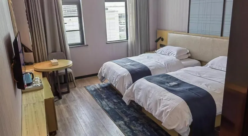 Bed in Echarm Hotel Wuhan Changjiang New District Gaoche Metro Station