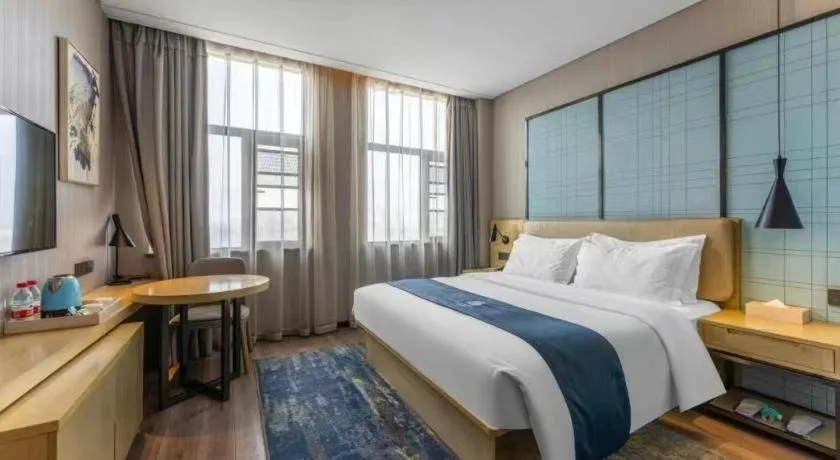 Bed in Echarm Hotel Wuhan Changjiang New District Gaoche Metro Station