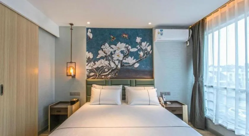 Bed in Magnotel Hotel Suzhou Shiquan Street Wangshiyuan