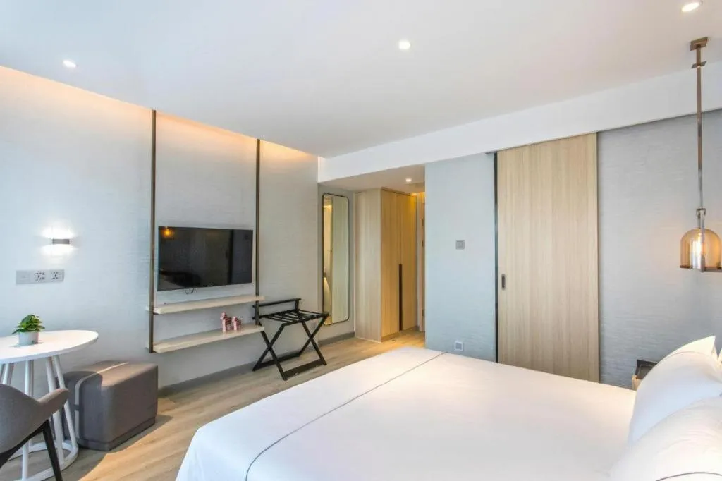 Bed in Magnotel Hotel Suzhou Shiquan Street Wangshiyuan