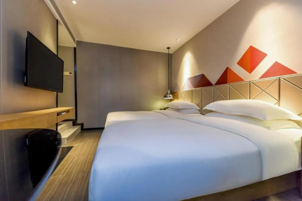 Bed in Borrman Hotel Guangzhou Quzhuang Metro Station