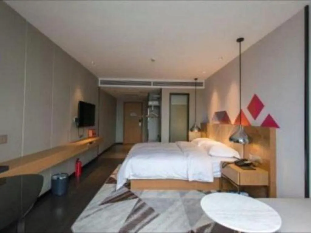 Bed in Borrman Hotel Guangzhou Quzhuang Metro Station