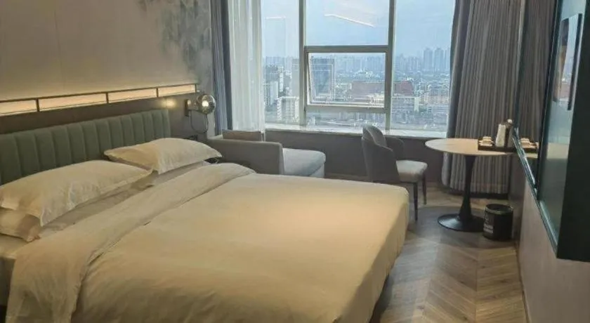 Bed in Borrman Hotel Guangzhou Quzhuang Metro Station