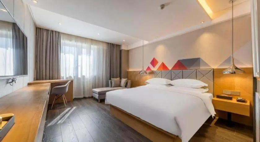 Bed in Borrman Hotel Kunming Dianchi South Asia Fengqingyuan