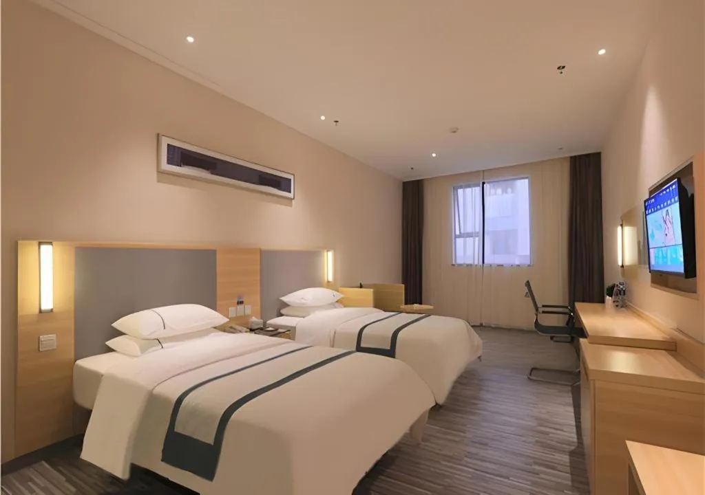 Bed in City Comfort Inn Zhongshan Nanqu Subdistrict Yong'an Square