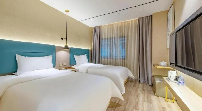 Bed in ZMAX Hotels Shenzhen Lianhuacun Metro Station