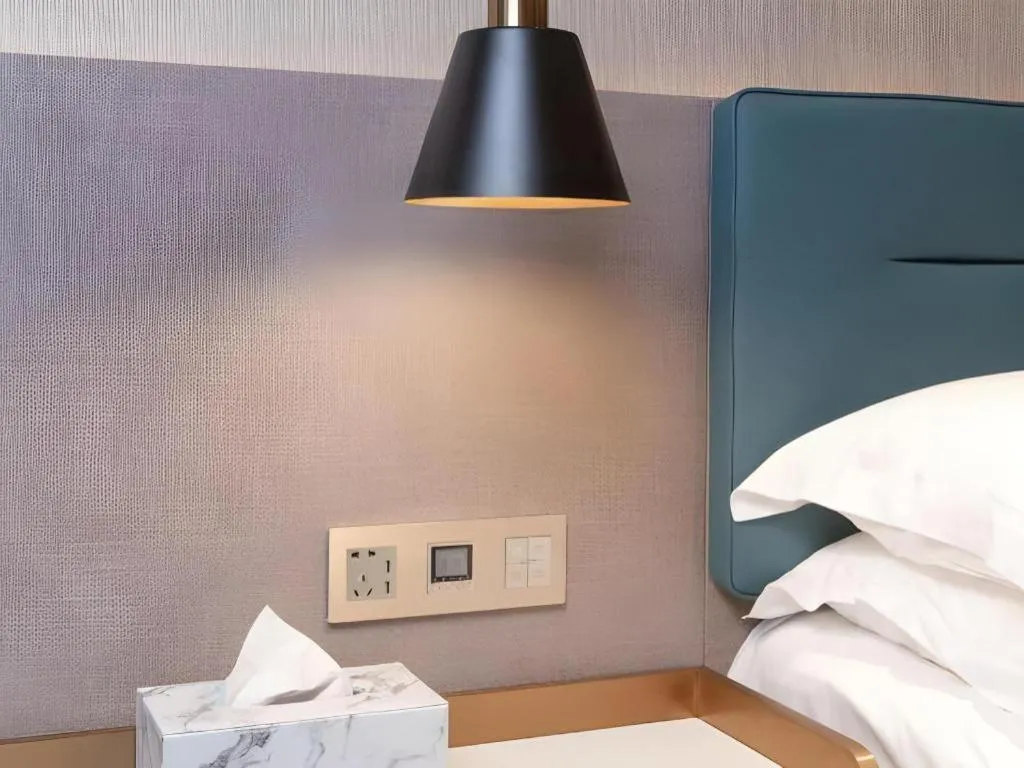 Bed in ZMAX Hotels Shenzhen Lianhuacun Metro Station