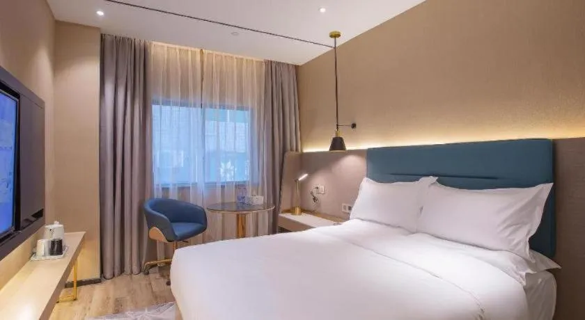 Bed in ZMAX Hotels Shenzhen Lianhuacun Metro Station