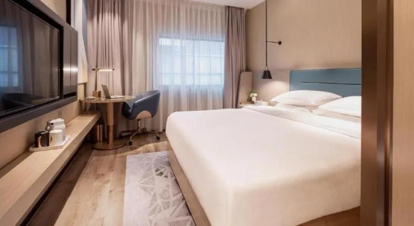 Bed in ZMAX Hotels Shenzhen Lianhuacun Metro Station