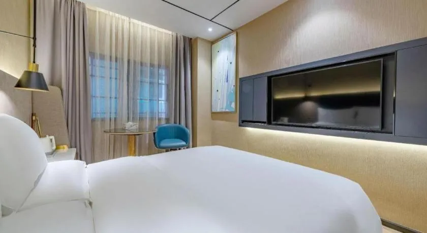 Bed in ZMAX Hotels Shenzhen Lianhuacun Metro Station