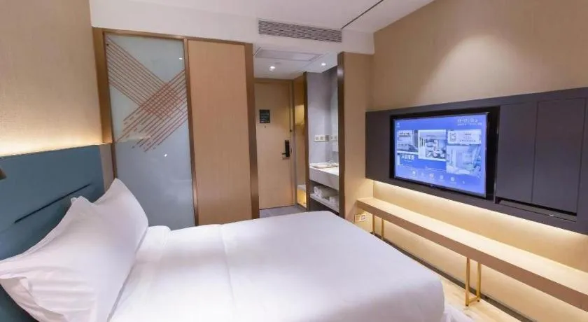 Bed in ZMAX Hotels Shenzhen Lianhuacun Metro Station