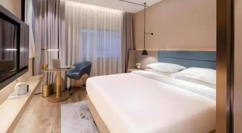 Bed in ZMAX Hotels Shenzhen Lianhuacun Metro Station