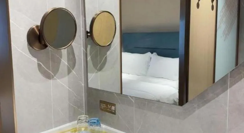 Bed in ZMAX Hotels Shenzhen Lianhuacun Metro Station