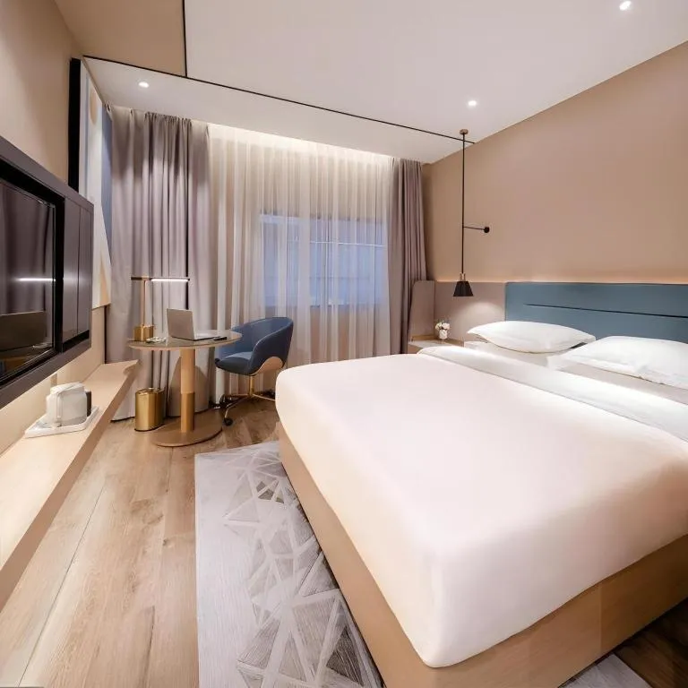 Bed in ZMAX Hotels Shenzhen Lianhuacun Metro Station