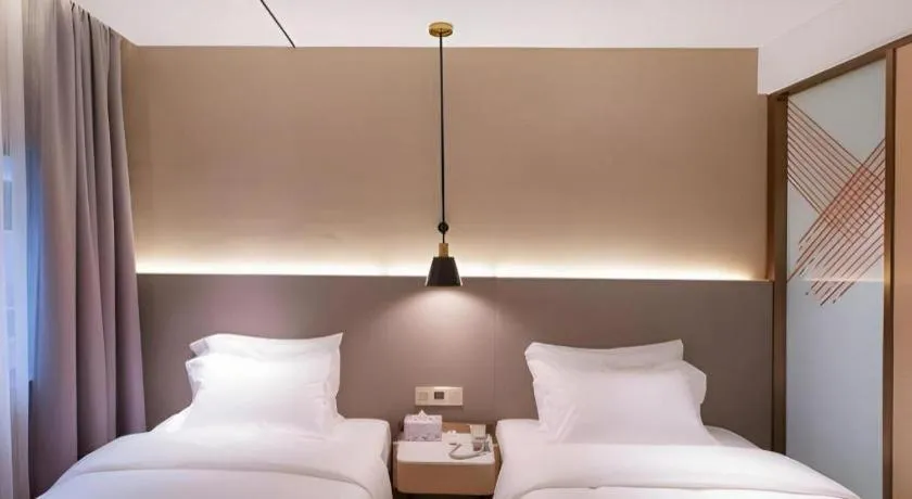 Bed in ZMAX Hotels Shenzhen Lianhuacun Metro Station