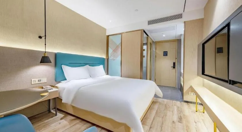 Bed in ZMAX Hotels Shenzhen Lianhuacun Metro Station