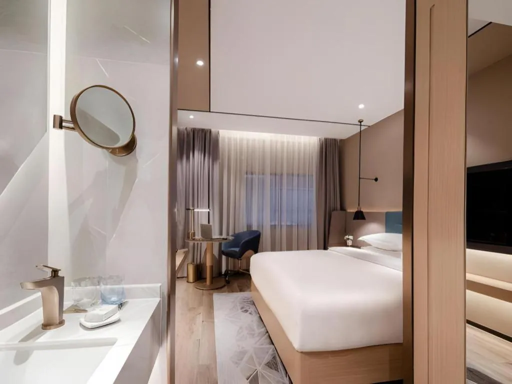 Bed in ZMAX Hotels Shenzhen Lianhuacun Metro Station