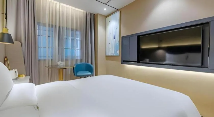 Bed in ZMAX Hotels Shenzhen Lianhuacun Metro Station