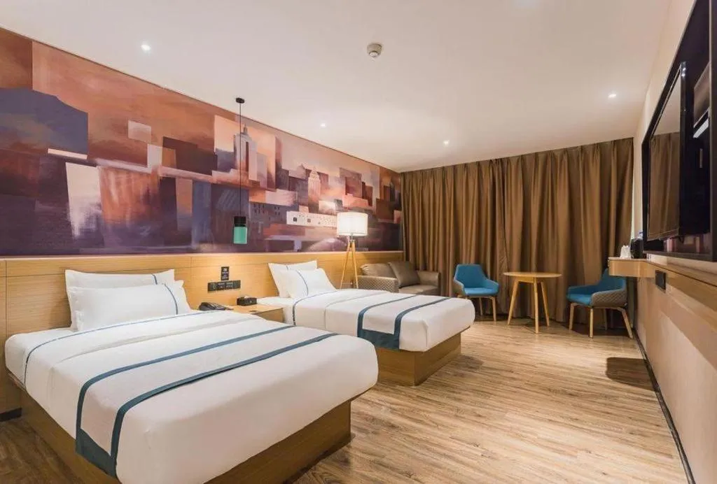 Bed in City Comfort Inn Dongguan Wangniudun