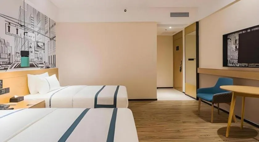 Bed in City Comfort Inn Dongguan Wangniudun