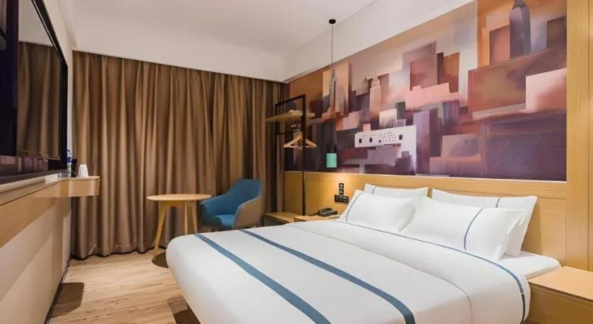 Bed in City Comfort Inn Dongguan Wangniudun