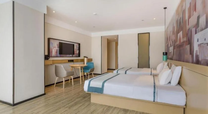 Bed in City Comfort Inn Dongguan Wangniudun