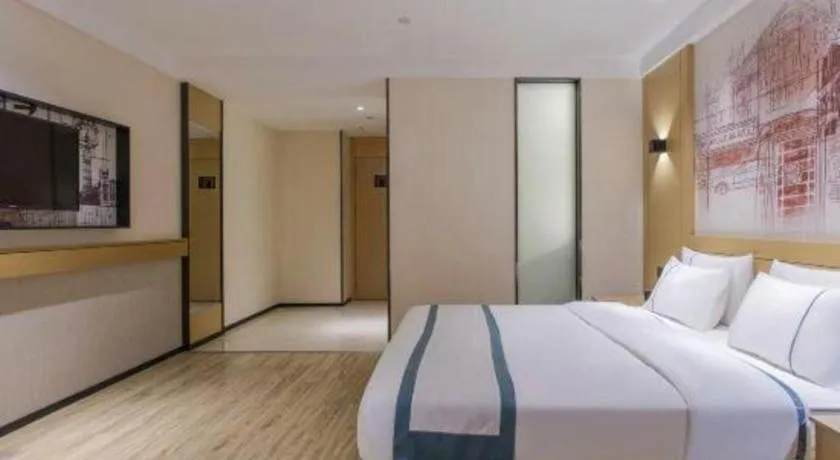 Bed in City Comfort Inn Dongguan Wangniudun